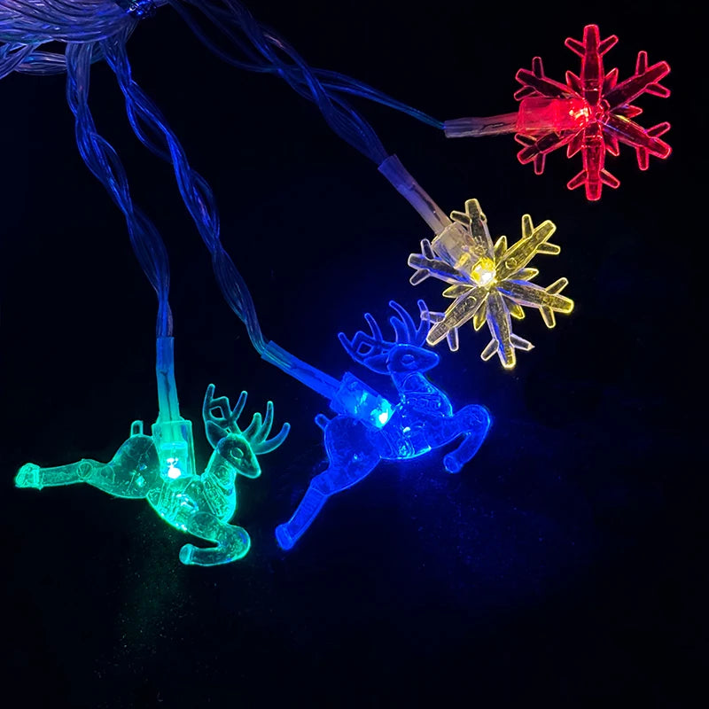 cordão de luzes de natal com figuras de árvores e renas - foto 5