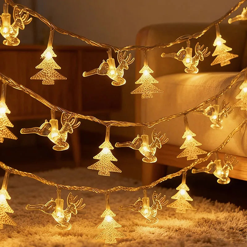 cordão de luzes de natal com figuras de árvores e renas - foto 7