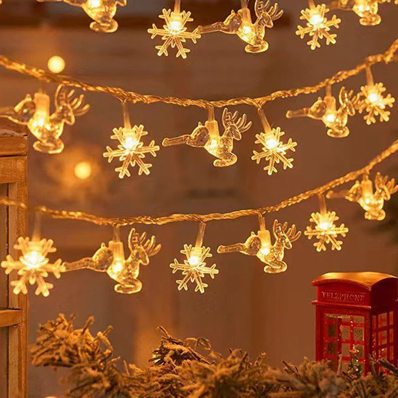 cordão de luzes de natal com figuras de árvores e renas - foto 8