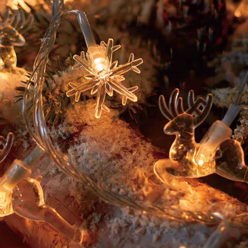 cordão de luzes de natal com figuras de árvores e renas - foto 9