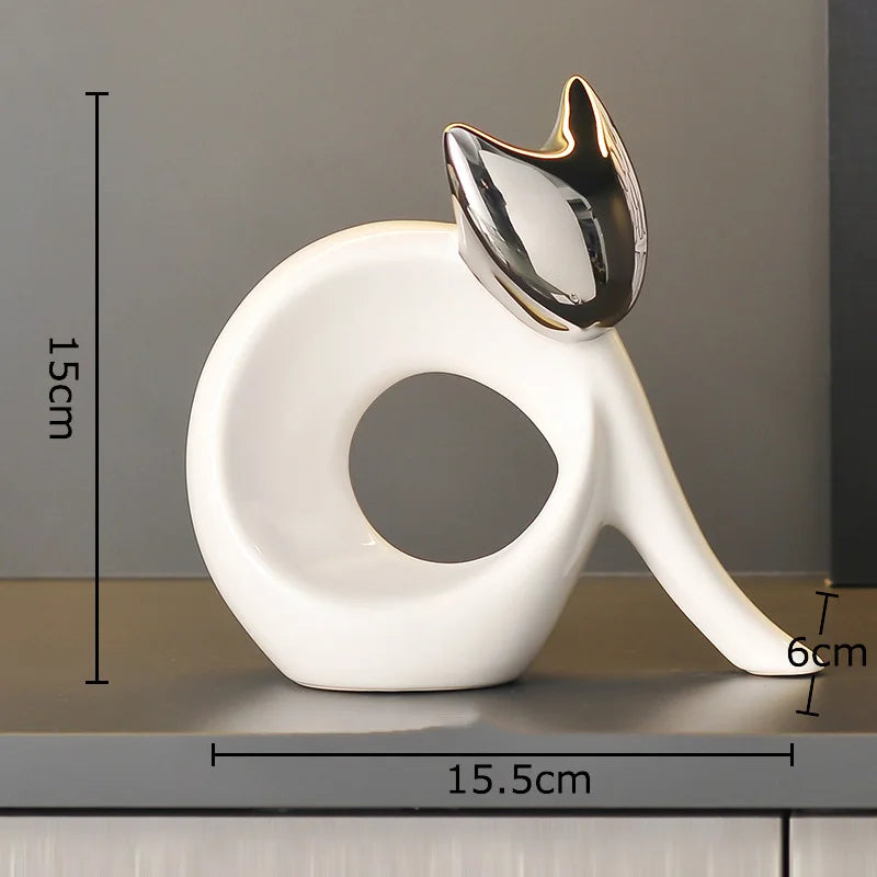 escultura de gato abstrato em cerâmica dourada - foto 11