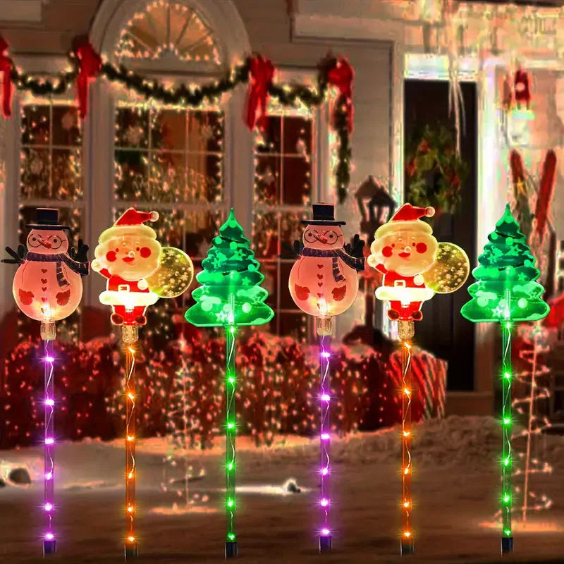 luzes solares de natal em estaca coloridas no jardim - foto 2