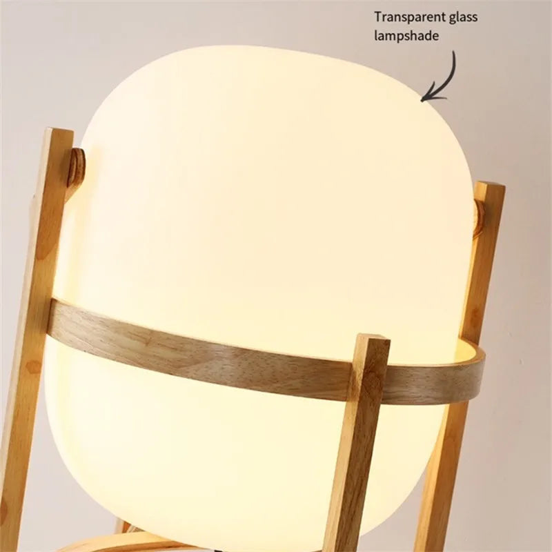 abajur de vidro opalino minimalista em formato de cesta aceso na mesa lateral - foto 5