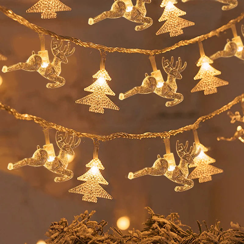 cordão de luzes de natal com figuras de árvores e renas - foto 14