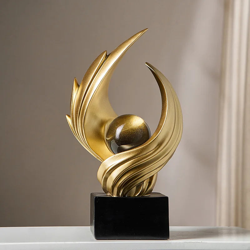 escultura abstrata de resina em ouro fosco - foto 2