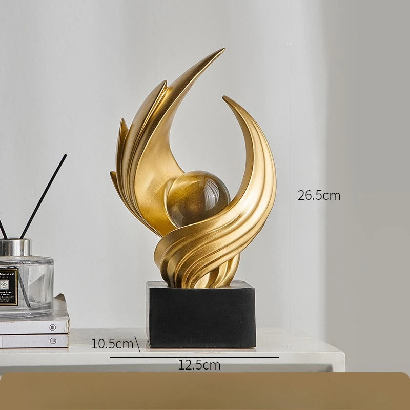 escultura abstrata de resina em ouro fosco - foto 6