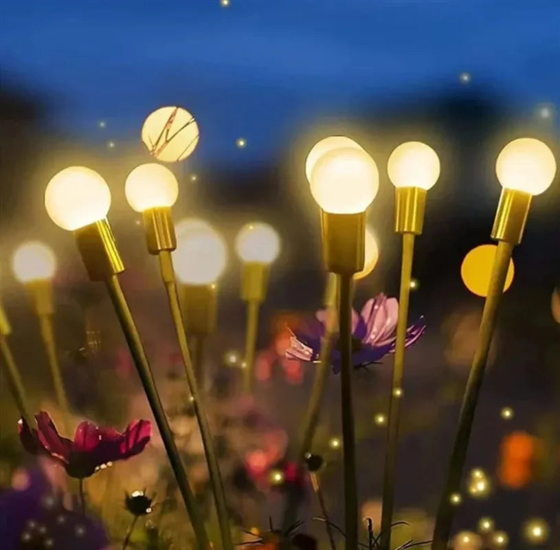 luzes solares efeito vaga-lume entre as plantas do jardim - foto 2