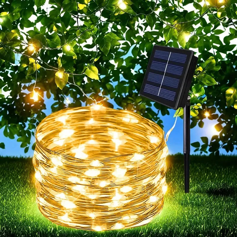 pisca-pisca solar de led aceso envolvendo árvore no jardim - foto 2